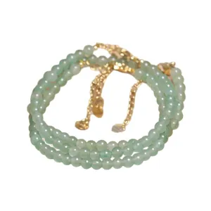 Elegant green aventurine beaded necklace with adjustable gold chain extension