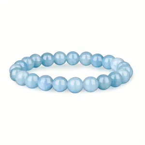 Detailed close-up view of 8mm light blue natural healing stone beaded elastic bracelet