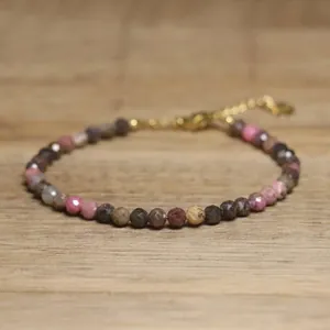 Close-up of handmade faceted natural stone beaded bracelet with adjustable clasp.