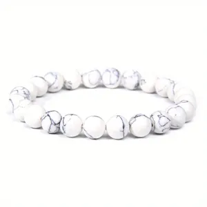 Detailed close-up of 8mm white howlite beaded bracelet with black marble marble texture