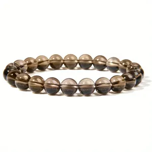 Detailed view of 8mm translucent smoky quartz healing stone beaded elastic bracelet