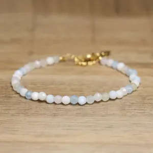 Exquisite macro detail of faceted natural stone beads on a dainty adjustable bracelet.