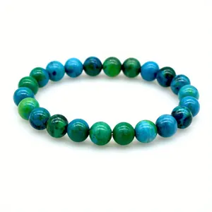 Detail shot of 8mm green and blue marbled stone bead stretch bracelet on white background