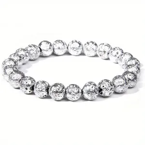 Macro view of 8mm silver-plated lava stone beaded bracelet for healing and energy.