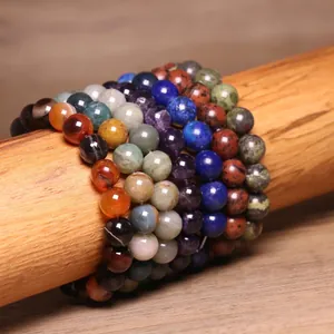 Close-up macro view of multi-colored 8mm natural stone beads with smooth polished finish