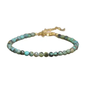 Handmade African turquoise beaded bracelet with faceted stones and gold chain