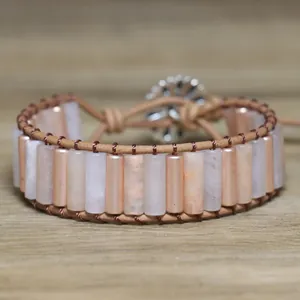 Detailed view of handmade pink stone bead woven bracelet with adjustable cord