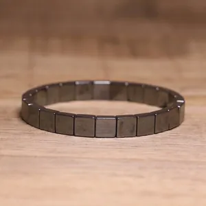 Macro view of square hematite beads on a sleek and modern elastic rope bracelet