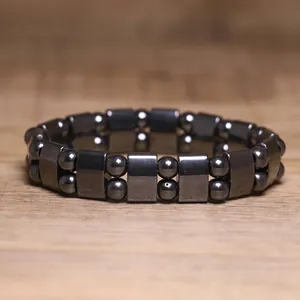 Detail view of magnetic hematite bracelet featuring square and round beads