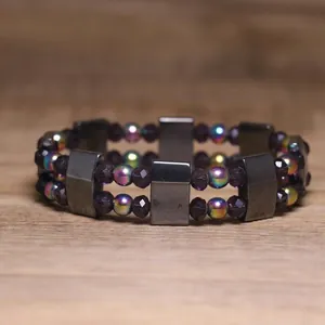 Close-up of double strand hematite elastic bracelet with iridescent purple beads