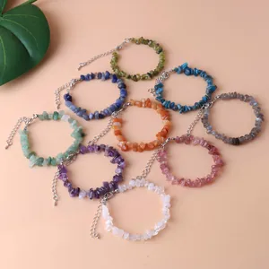 Close-up of various natural irregular crystal chip bracelets with adjustable lobster clasps.
