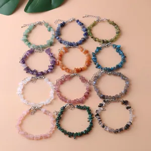 Selection of 12 colorful natural crystal chip bracelets with adjustable lobster clasp chain.