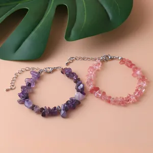 Close-up of natural irregular amethyst and rose quartz bracelets with lobster clasp