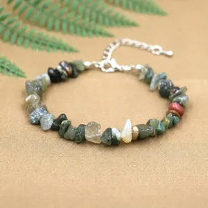 Detailed view of a natural green stone chip bracelet with a silver lobster clasp