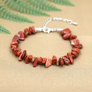 Close-up of natural irregular red stone chip bead bracelet with lobster clasp