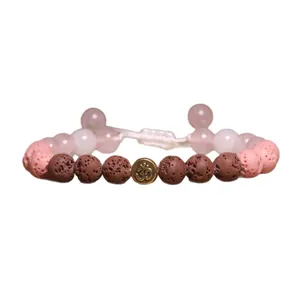 Handgemaakte lavasteen kralenarmband met antiek Om-symbool en gevlochten touw