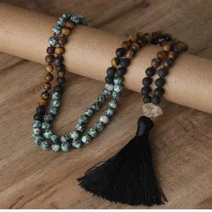 Detailed view of handmade natural stone necklace with tiger's eye beads and black tassel