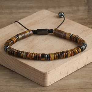 Macro view of natural tiger eye stone beads on a handmade adjustable drawstring bracelet.