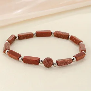 Healing brown goldstone energy bracelet featuring rectangle beads and shiny silver accents