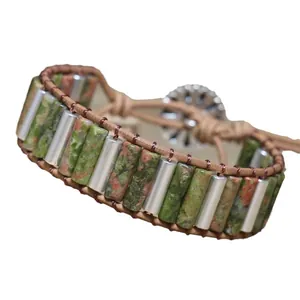 Handmade woven adjustable bracelet with natural Unakite stone cylinders and metal tubes.