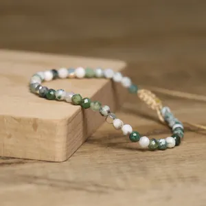Macro detail of natural agate 4mm faceted beads on a handmade adjustable bracelet.