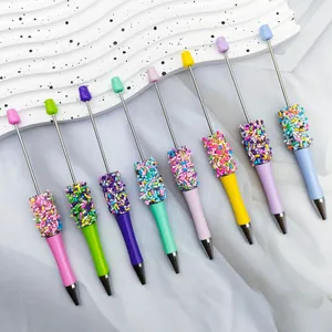 Detail of colorful candy sprinkle beaded pens in various vibrant pastel colors.