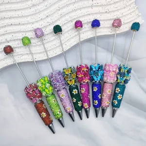 Colorful handmade rhinestone beaded ballpoint pens with butterfly rose and daisy details