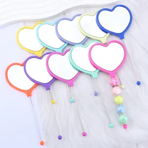Pastel colorful heart-shaped handheld mirrors with decorative beaded handles for makeup