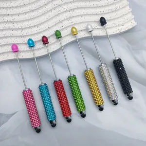 Detailed view of seven colorful rhinestone DIY beaded stylus pens for touchscreens