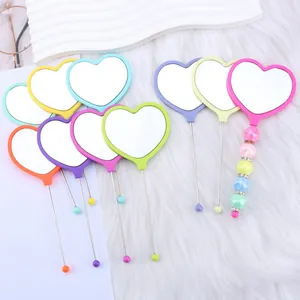 Colorful heart-shaped handheld mirrors with cute beaded handles for portable makeup vanity