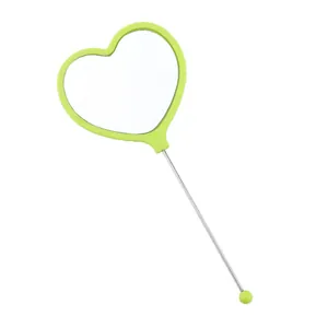 Heart-shaped handheld makeup mirror with green frame and portable long handle