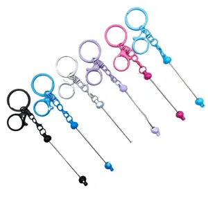 Assorted colorful DIY beaded keychains featuring lobster clasps and metal rods for bag charms
