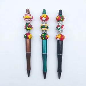 Set of three Christmas themed beaded ballpoint pens featuring festive hand-painted charms