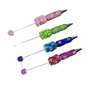 Luxurious rhinestone beaded ballpoint pens featuring handmade floral and pearl designs