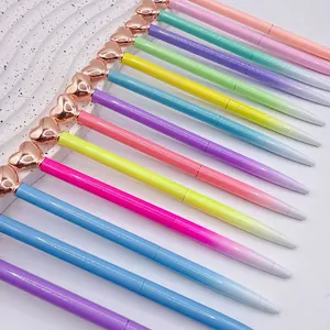 Set of colorful gradient heart ballpoint pens with elegant rose gold metal accents