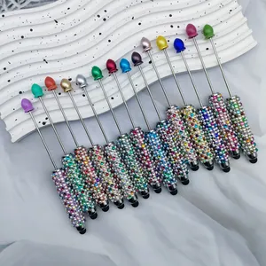 Detail view of colorful DIY stylus pens featuring sparkling rhinestone grips in multiple colors