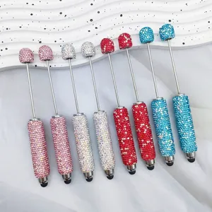 Macro view of luxurious rhinestone-encrusted stylus pens in various bright colors.