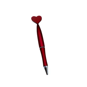 Elegant red Valentine's Day ballpoint pen featuring a heart-shaped top on white background