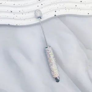 Macro view of luxurious AB rhinestone encrusted stylus pen with silver metal accents