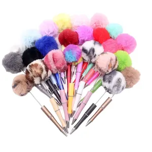 Assorted cute colorful pom pom bead ballpoint pens featuring plush fur tops for DIY kits