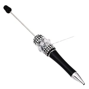 Elegant black ballpoint pen with sparkling rhinestones and white lace bow detail