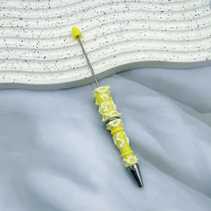 Elegant yellow and white cream glue decorated ballpoint pen with handcrafted 3D textures
