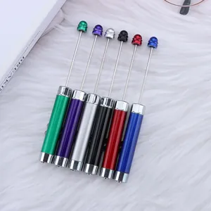 Professional multi-colored DIY beaded pointer and laser pen set displayed on white faux fur