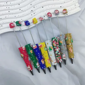 Bolígrafos navideños de cuentas hechos a mano con dijes de Papá Noel