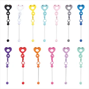 Detailed view showing candy-colored heart-shaped silicone straw charms in 13 vibrant colors.