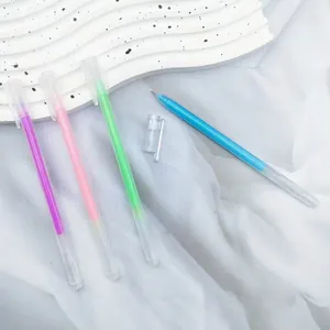 Detailed view of colorful pastel glitter pens with transparent barrels on white fabric