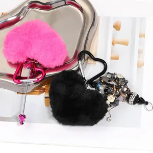 Plush heart keychains with heart-shaped carabiners and decorative crystal beads.