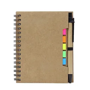 Kraft paper spiral notebook with colorful sticky notes and black pen attached