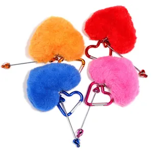 Set of four colorful heart-shaped plush pom-pom keychains with carabiners