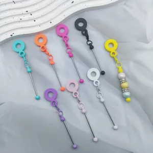 Creative DIY silicone bead straw charms in vibrant candy colors on a decorative tray